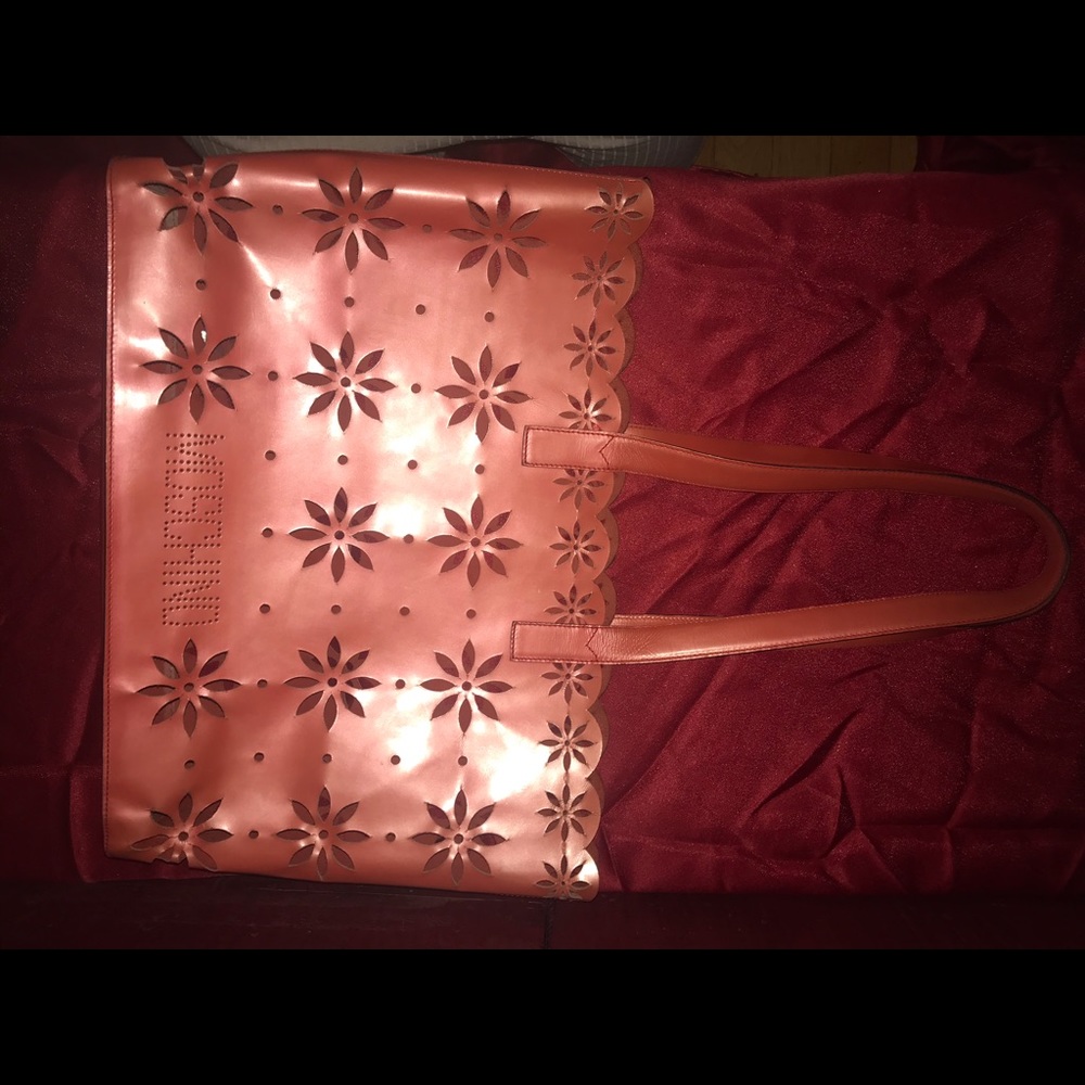 Moschino leather Laser cut shopper. Mint condition. Suede interior.